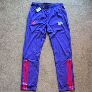 Adidas Vibrant Purple Track Pants with Red Stripes